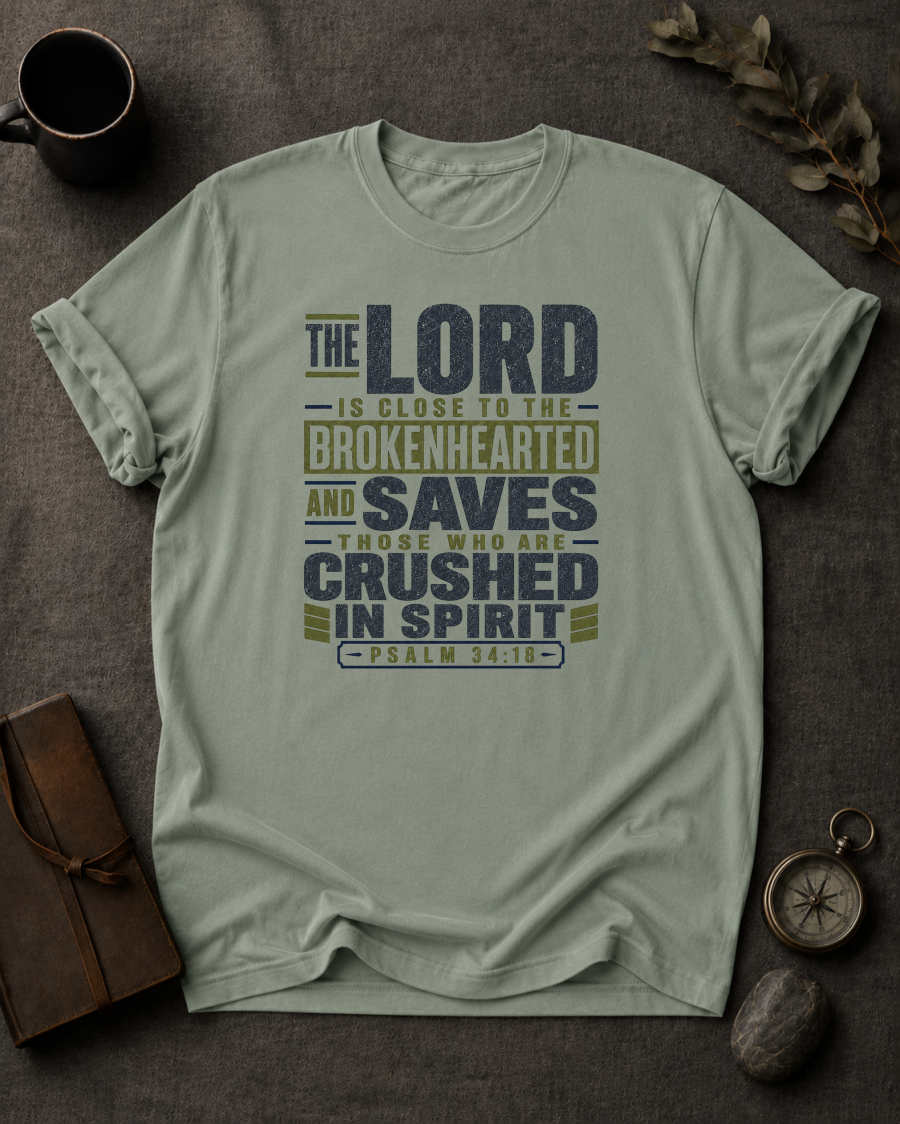 bay Comfort Colors t-shirt with navy and olive Psalm 34:18 typography design — 'The Lord is close to the brokenhearted'"