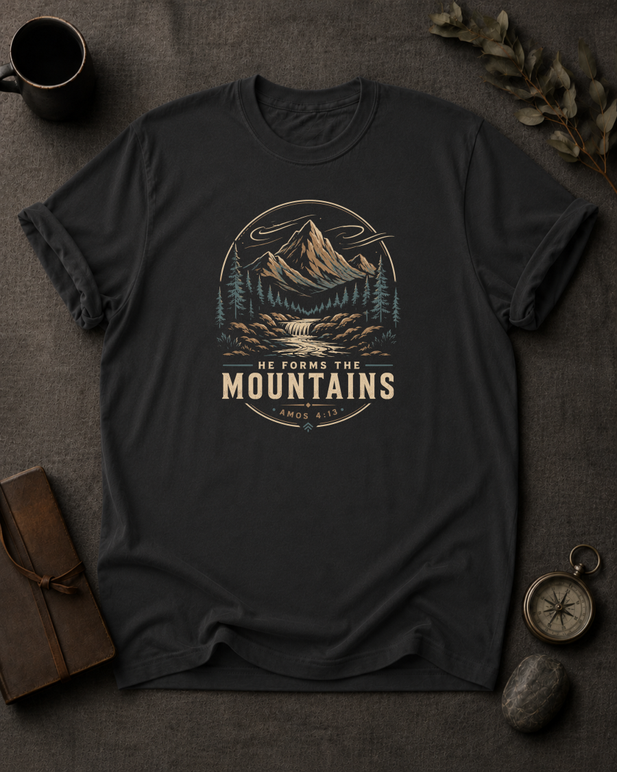 black Comfort Colors t-shirt with mountain waterfall design and Amos 4:13 — 'He Forms the Mountains'