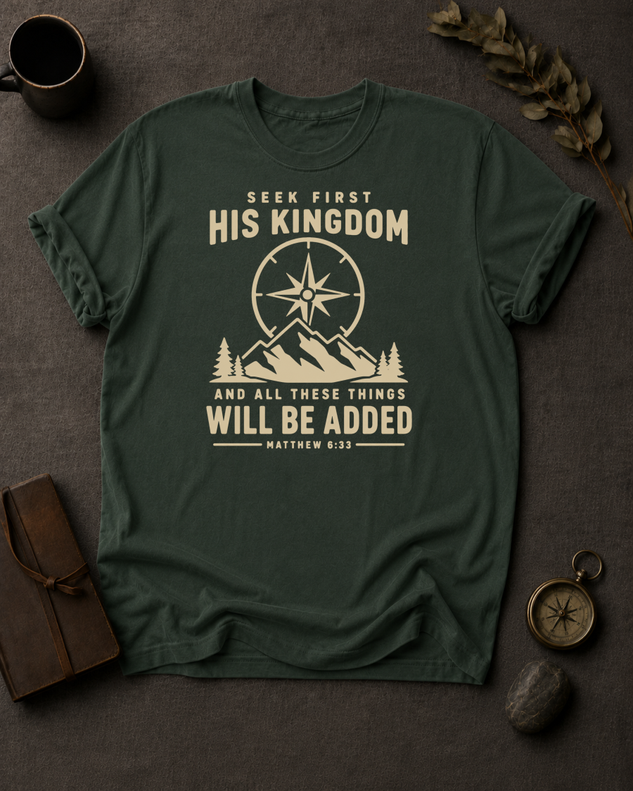 moss Comfort Colors t-shirt with compass and mountain design reading 'Seek First His Kingdom, and all these things will be added, Matthew 6:33'"