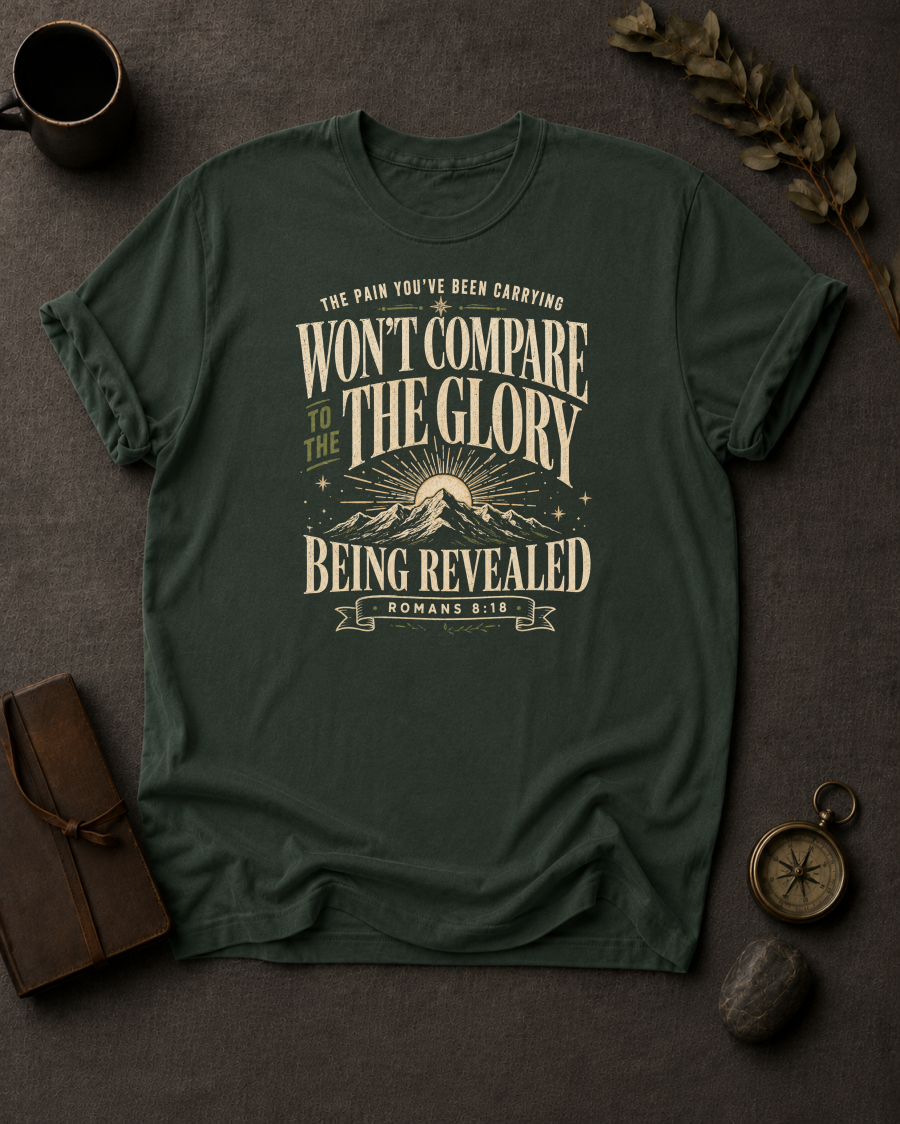 moss Comfort Colors t-shirt with mountain sunrise design and Romans 8:18 — 'Won't compare to the glory being revealed