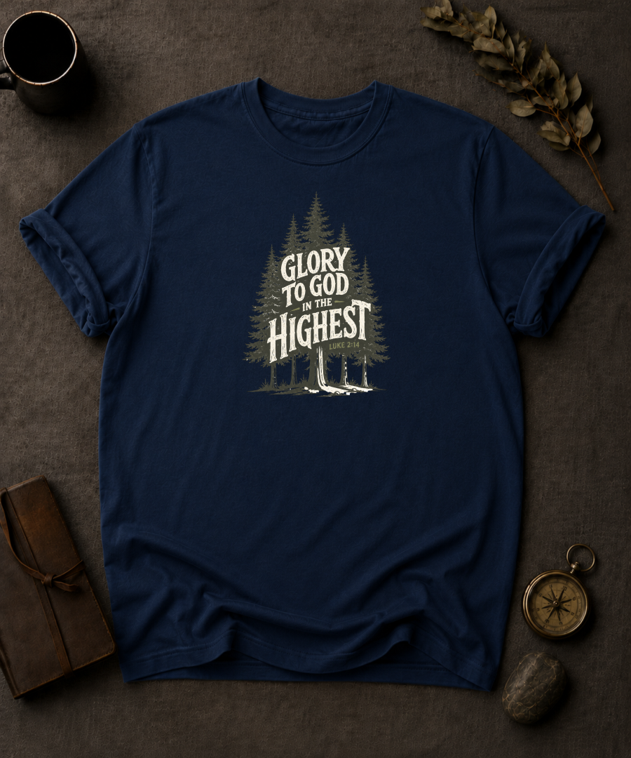 navy Comfort Colors t-shirt with pine forest illustration reading 'Glory to God in the Highest, Luke 2:14'"