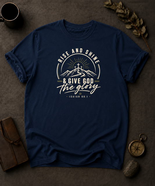 bay Comfort Colors t-shirt with "Rise and Shine & Give God the Glory" Isaiah 60:1 mountain sunrise cross design in Bay colorway, styled with coffee mug, compass, and leather journal