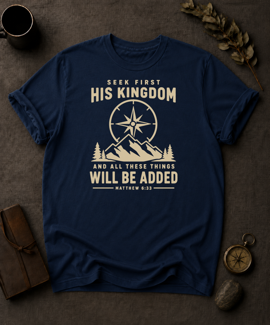 navy Comfort Colors t-shirt with compass and mountain design reading 'Seek First His Kingdom, and all these things will be added, Matthew 6:33'"