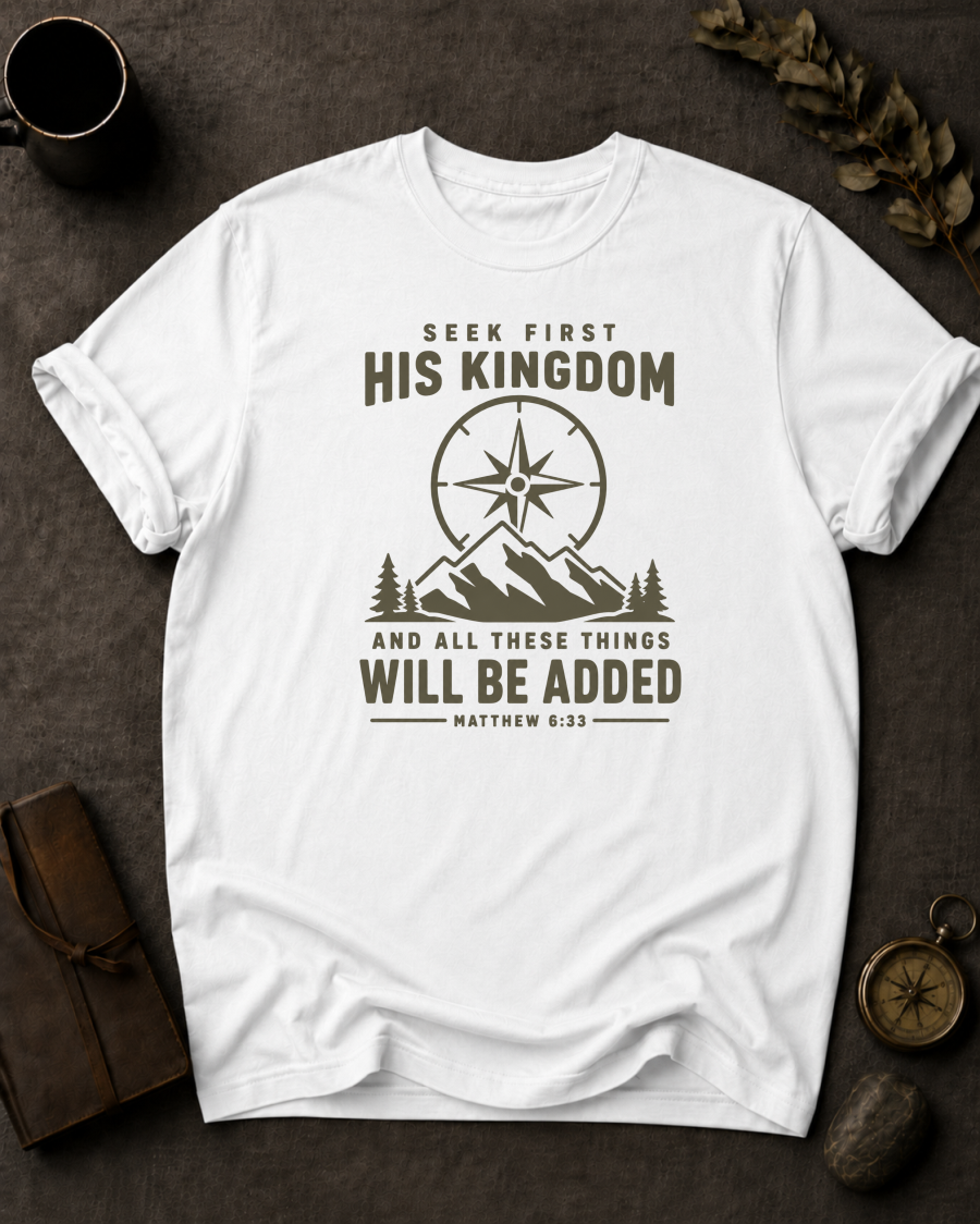 white Comfort Colors t-shirt with compass and mountain design reading 'Seek First His Kingdom, and all these things will be added, Matthew 6:33'"